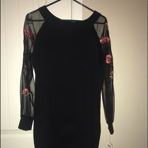 Black mini dress with mesh sleeves